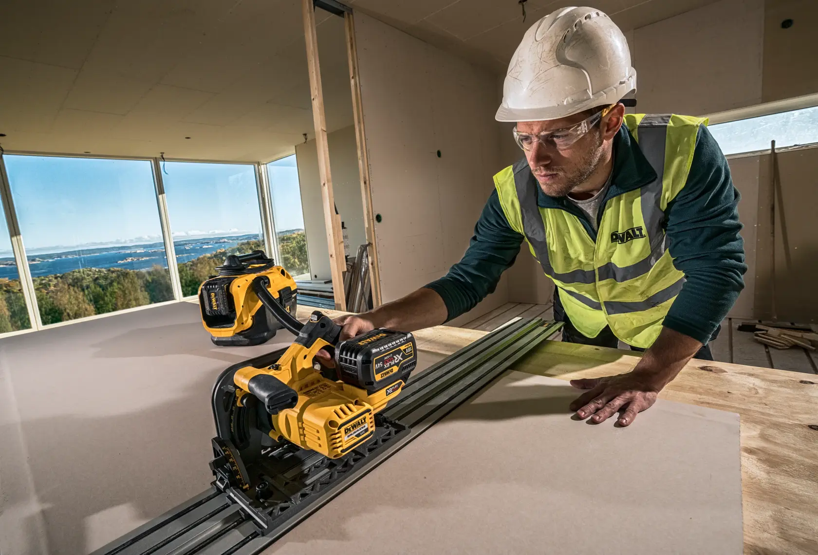 DEWALT portable wet/dry vacuum with handle and hose, yellow and black, model DCV584L.