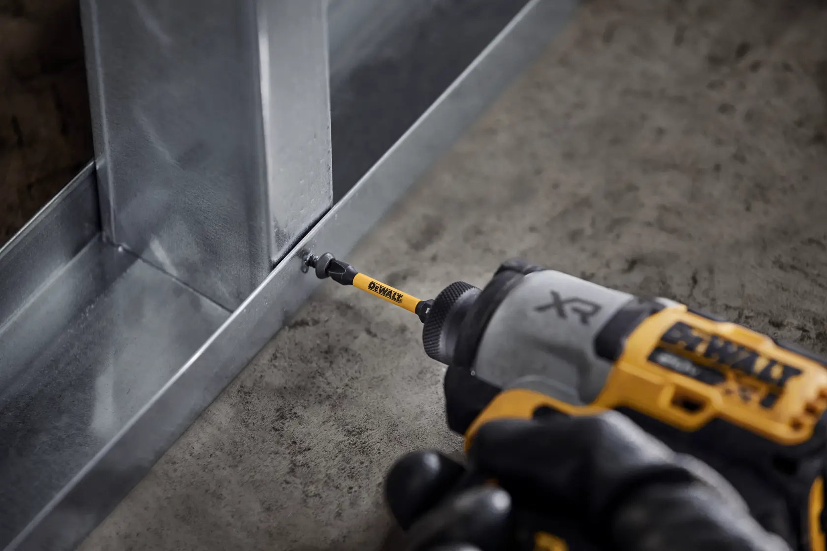 DEWALT yellow case with assorted drill bits and screwdriver bits, organized in slots.